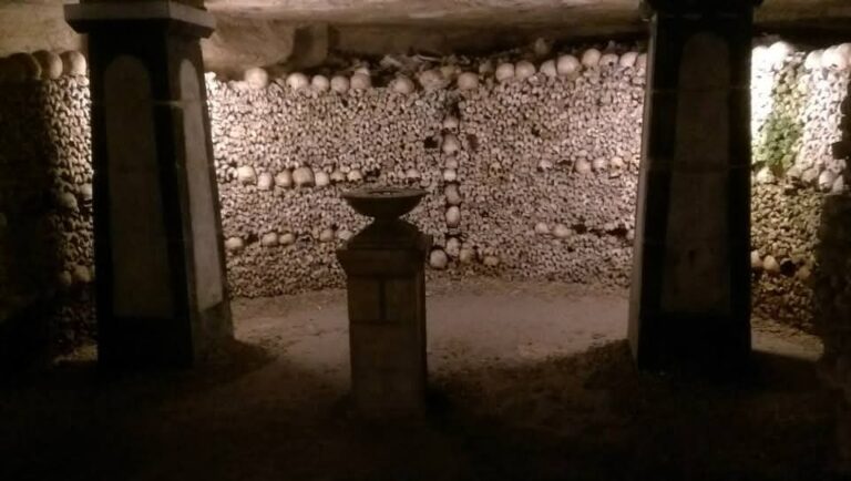 Spooky Catacombs of Paris with an alter around bones